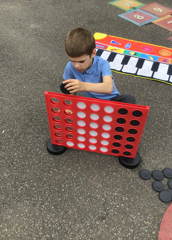 Child playing connect-4 1