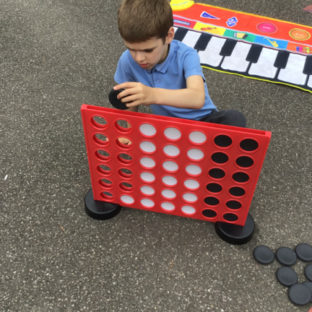 Child playing connect-4 1